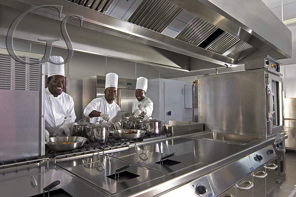 Three chefs in their new kitchen at Luba Freeport, Equatorial Guinea