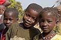 Mixed expressions on faces of village children, Sierra Leone