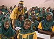 Girls and boys in Islamic school class with teacher, Sierra Leone
